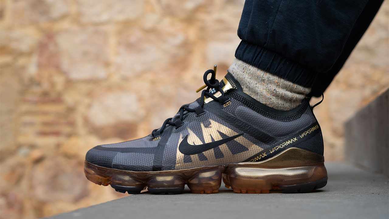 gold and black nike vapormax